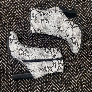 Black and white snakeskin boots